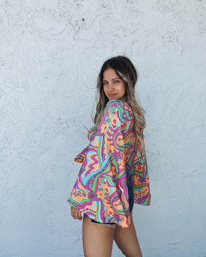 Psychedelic Daisy Bell Sleeve Wrap Top
